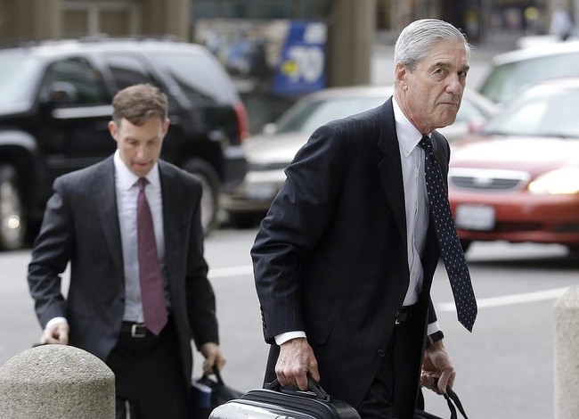 FILE - In this April 21, 2016 file photo, attorney and former FBI Director Robert Mueller, right, arrives for a court hearing at the Phillip Burton Federal Building in San Francisco. Mueller has been overseeing settlement talks with Volkswagen, the U.S. government and private lawyers. Mueller is being honored with an award from West Point. The U.S. Military Academy’s Association of Graduates will present the Thayer Award to Mueller on Thursday evening, Oct. 6, 2016. (AP Photo/Jeff Chiu, File)