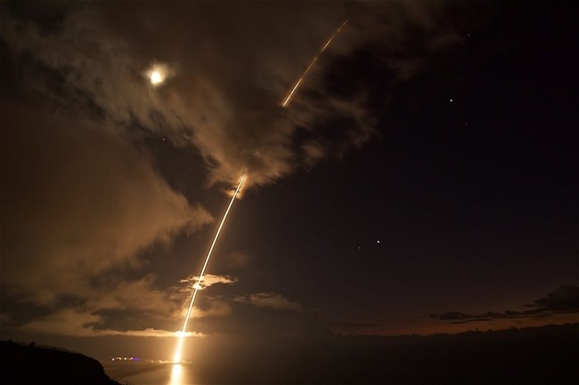 This Aug. 29, 2017 photo provided by the Department of Defense shows a medium-range ballistic missile target is launched from the Pacific Missile Range Facility on Kauai, Hawaii. The U.S. military has shot down a medium range ballistic missile during a test off Hawaii. The Pacific Missile Range Facility on Kauai Island launched the target missile late Tuesday, Aug. 29. Sailors aboard the destroyer USS John Paul Jones tracked the target with radar and then fired an interceptor missile to shoot it down. The test comes amid ongoing North Korean ballistic missile tests. Earlier Tuesday (Latonja Martin/Department of Defense via AP)