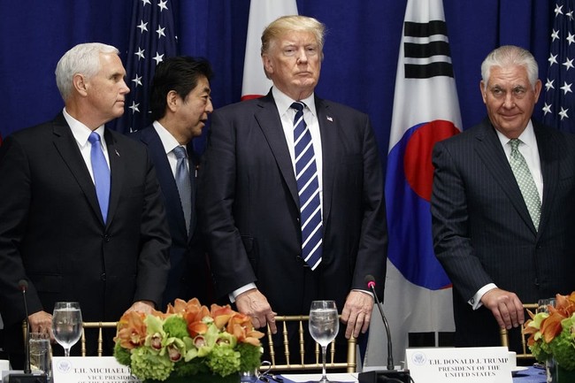 Japanese Prime Minister Shinzo Abe walks to his seat at a luncheon with President Donald Trump and South Korean President Moon Jae-in at the Palace Hotel during the United Nations General Assembly, Thursday, Sept. 21, 2017, in New York. From left, Vice President Mike Pence, Abe, Trump, and Secretary of State Rex Tillerson. (AP Photo/Evan Vucci)