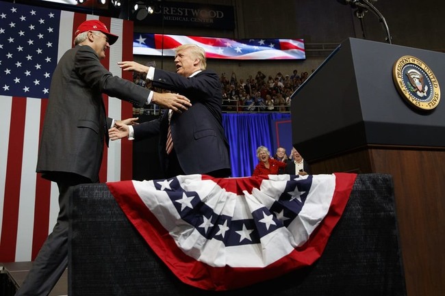 President Donald Trump hugs U.S. Senate candidate Luther Strange during a campaign rally, Friday, Sept. 22, 2017, in Huntsville, Ala. (AP Photo/Evan Vucci)