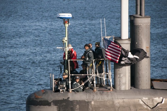 PUGET SOUND, Wash. (Sept. 11, 2017) Cmdr. Melvin Smith, commanding officer of the Seawolf-class fast-attack submarine USS Jimmy Carter (SSN 23), looks on as the submarine transits the Hood Canal on its way home to Naval Base Kitsap-Bangor. Jimmy Carter is the last and most advanced of the Seawolf-class attack submarines, which are all homeported at Naval Base Kitsap. (U.S. Navy photo by Lt. Cmdr. Michael Smith/Released)